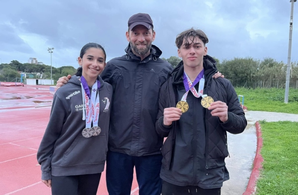Coach Edward Grech (centre) together with Raquela Calleja (left) and Andrea Grech. Photo: James Azzopardi/Athletics Malta